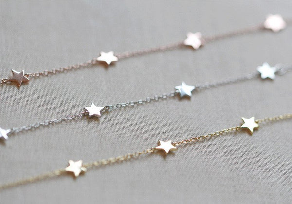 Six tiny little stars hang alongdelicate chain. Works great layered with other bracelets or all alone.
Details:
6 inches long with 2 inch extender
14kt gold