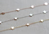 Six tiny little stars hang alongdelicate chain. Works great layered with other bracelets or all alone.
Details:

6 inches long with 2 inch extender
14kt gold